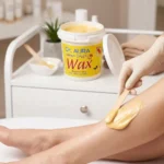 Applying lemon wax for gentle hair removal on skin